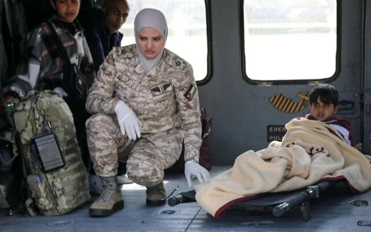 This handout picture released on March 4, 2025, by the Jordan Armed Forces (JAF), shows a child evacuated from the Gaza Strip arriving in an army helicopter at a hospital compound in Amman
(JAF photo)
