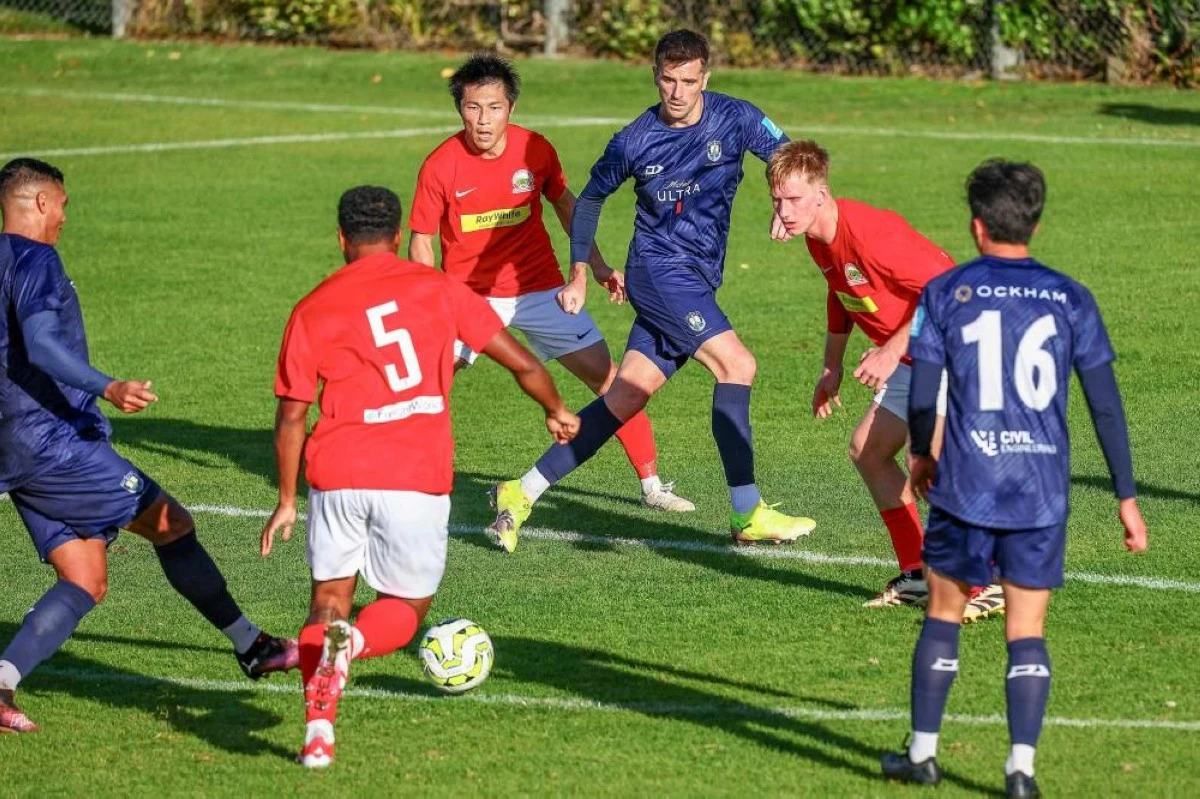 This photo taken on May 31shows Auckland City FC's Angus Kilkolly (top centre) in action during the football match between Auckland City FC and Onehunga Mangere United AFC in Auckland
(AFP photo)
