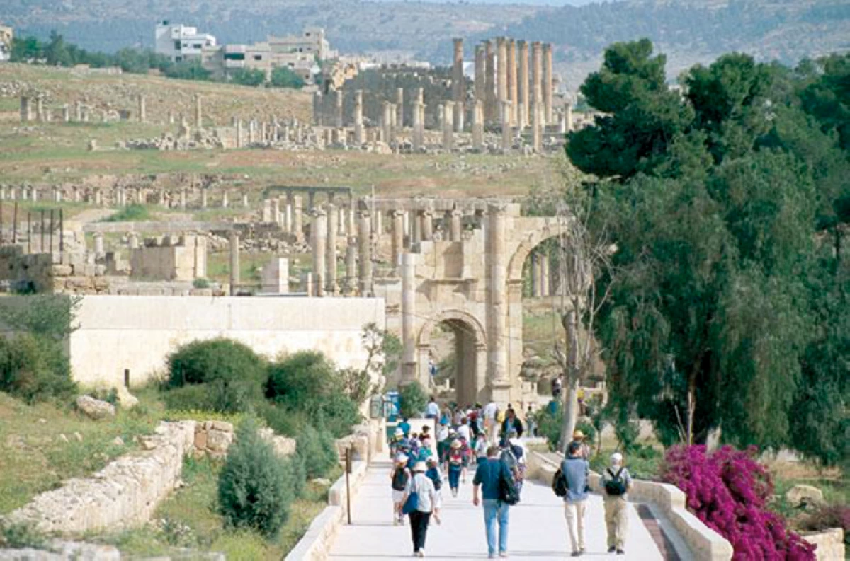 Visitors explore the ancient Roman ruins of Jerash, one of Jordan’s best-preserved archaeological sites (JT file)