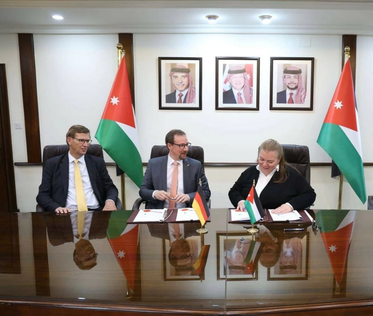 Minister of Planning and International Cooperation Zeina Toukan (right), Matthias Schmidt-Rosen, Director of the KfW Office in Jordan (centre) and the German Ambassador to Amman, Bertram von Moltke, sign three grant agreements on Tuesday, totaling €35 million
(Photo courtesy of the Ministry of Planning)