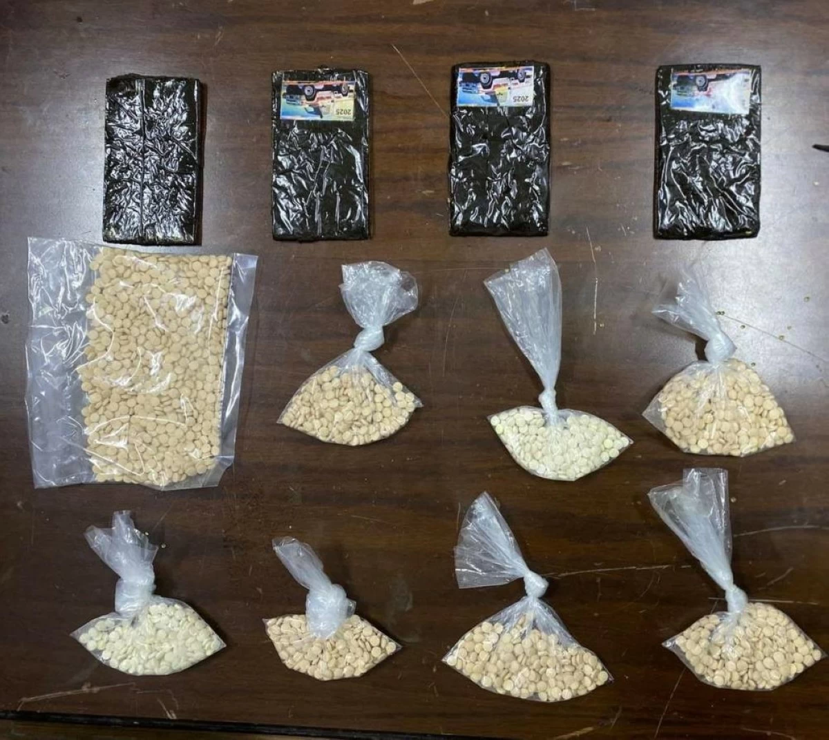 The Anti-Narcotic Department on Sunday announces the arrest of 13 suspects in connection with local and regional illicit drug operations in various parts of the Kingdom (Petra photo)