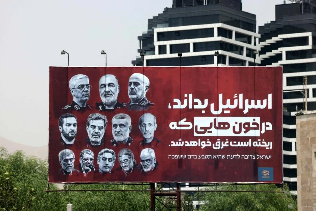 A billboard bearing pictures of Iranian senior military officials killed in recent Israeli attacks, is set up in a street in Tehran on June 26, 2025
(AFP photo)