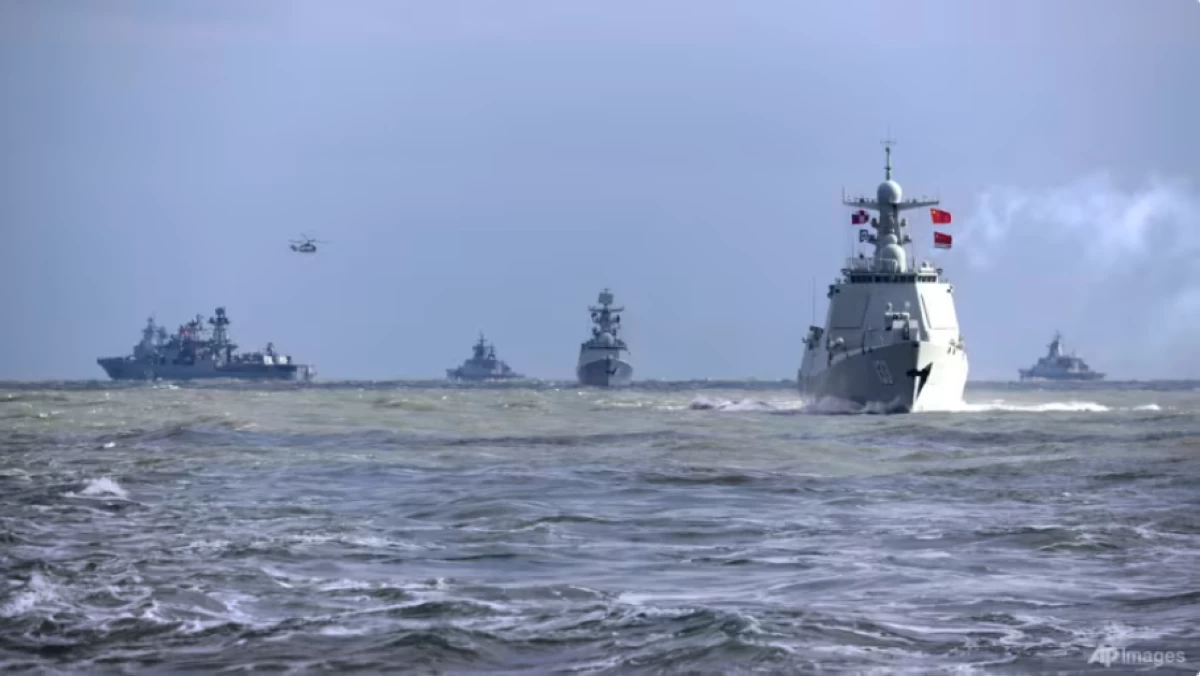 In this photo released by Xinhua News Agency, Chinese and Russian warships take part in joint naval drills in the East China Sea, Dec 27, 2022 (AFP photo)