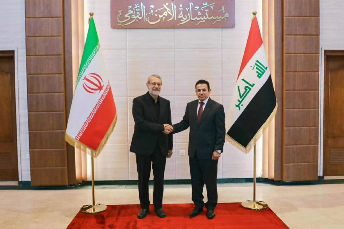 This handout picture released by Iraq's National Security Advisory shows National Security Adviser Qassim Alaraji meeting with Iran's head of the National Security Council Ali Larijani in Baghdad on Monday (AFP photo)