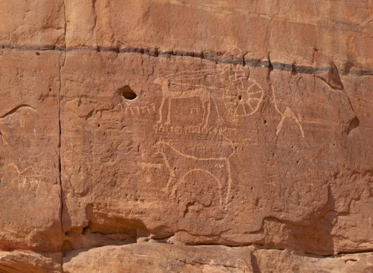 A lion and chariot are depicted in Al Ula, Saudi Arabia (Photo of Saudi Archaeology)