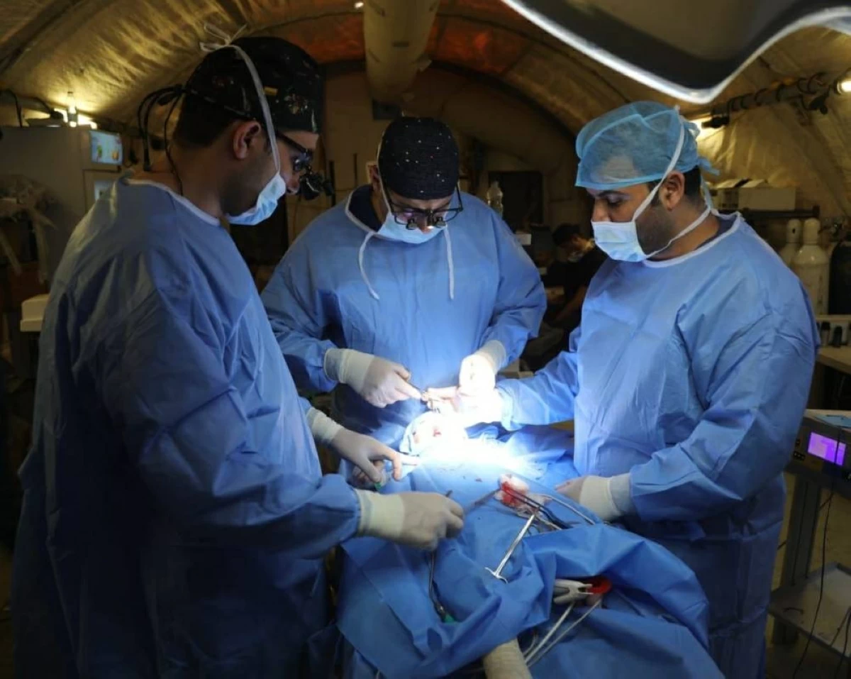 In this photo, provided on Monday by the  Jordan Armed Forces - Arab Army (JAF), medical team is seen performing a surgery at the Jordanian field hospital in southern Gaza Strip

(JAF photo)