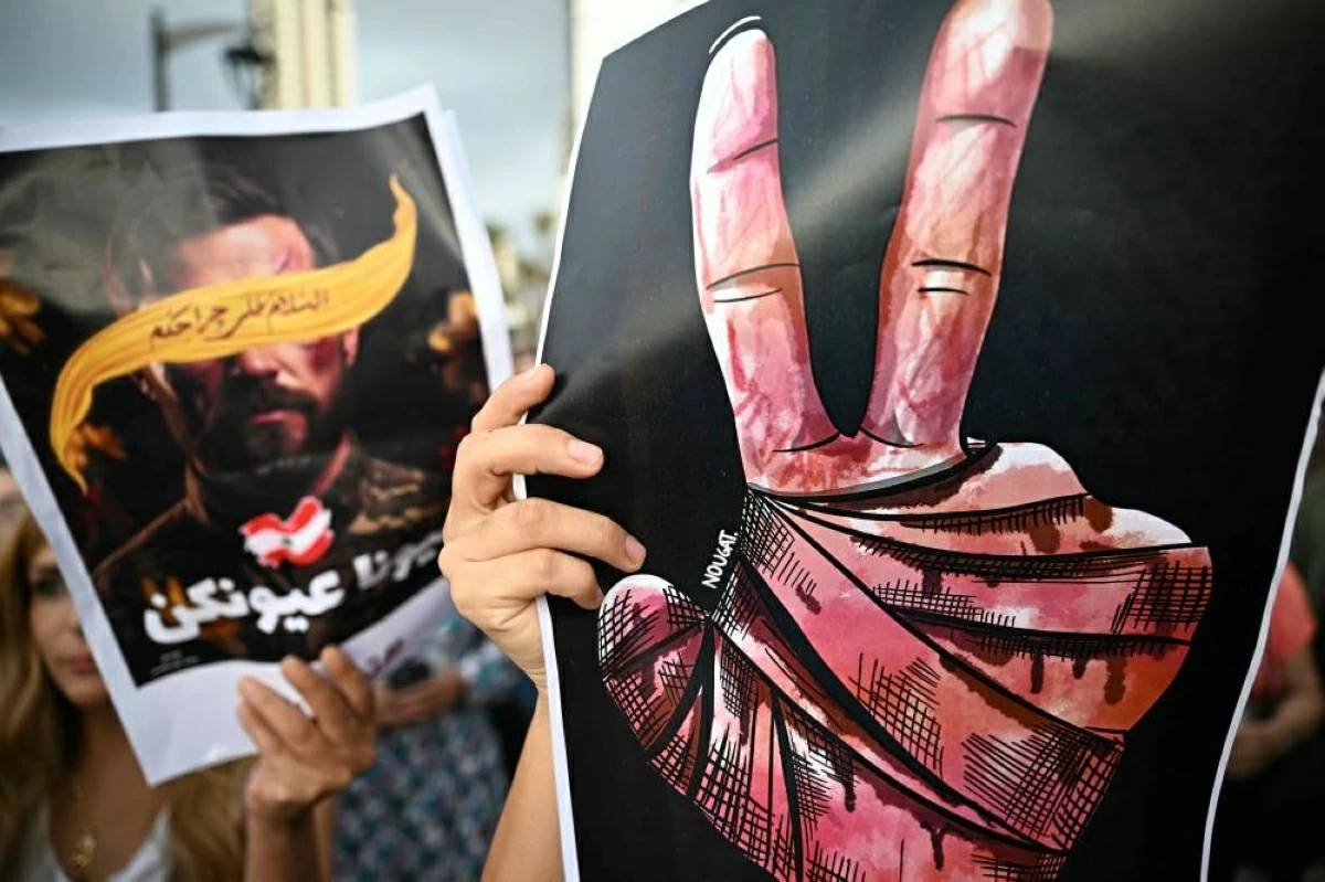 Supporters of Lebanon's Hizbollah group take part in a gathering in Beirut on September 17, 2025, to mark the one year anniversary of the Israeli operation in Lebanon that detonated hundreds of pagers and walkie-talkies used by Hizbollah.

(AFP photo)