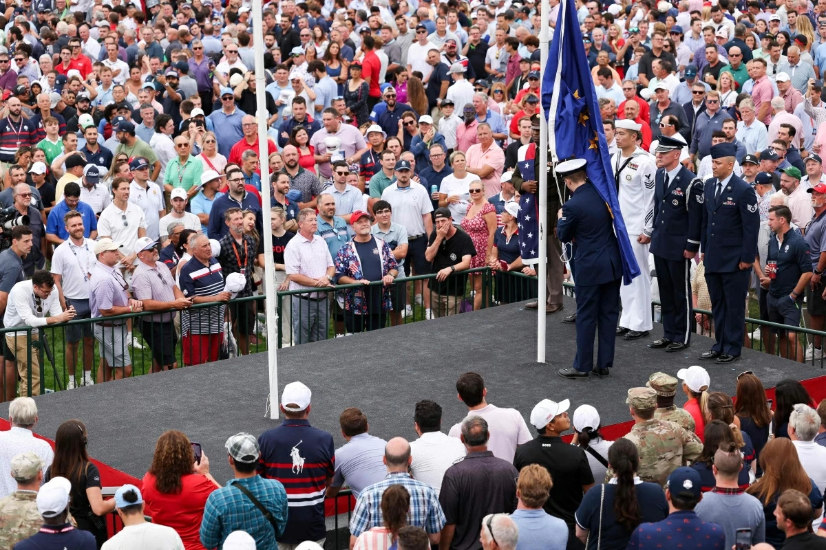 Flags are raised during the singing of the national anthem during the opening ceremony for the 2025 Ryder Cup at Black Course at Bethpage State Park Golf Course on Thursday in Farmingdale, New York
(AFP photo)