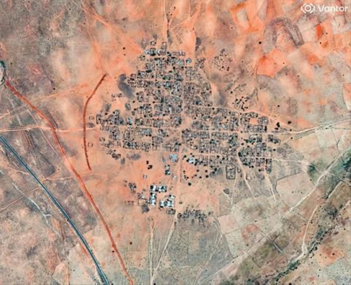 This handout satellite image by Vantor taken on October 15, 2025 and made available on October 31, 2025 shows a general view of a berm construction in Kinin Village near El Fasher (AFP photo)