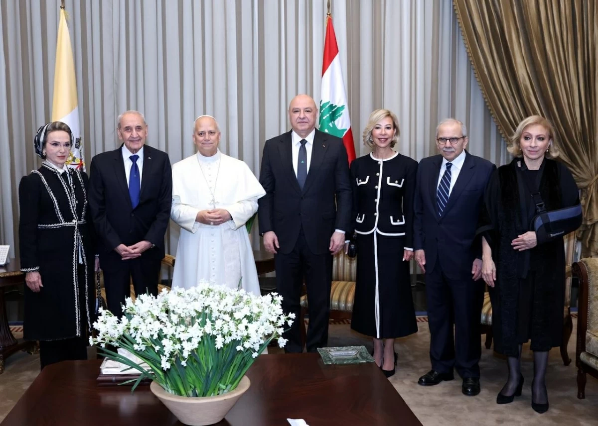 A photograph shows Pope Leo XIV posing with Lebanese Parliament Speaker Nabih Berri , his wife Randa, Lebanon's President Joseph Aoun , first lady Nehmat Nehme , Lebanon's Prime Minister Nawaf Salam , his wife Sahar Baassiri  at Beirut International Airport on November 30, 2025 (AFP photo)