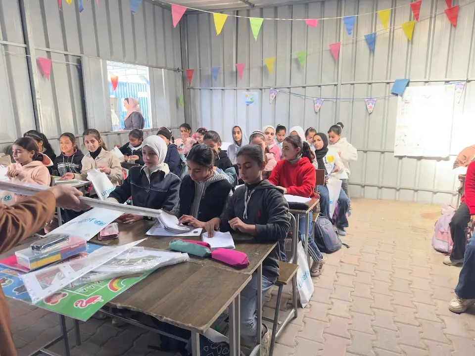 Students share desks in a crowded classroom in Deir al-Balah, Gaza on Jan. 31, 2026 (Photo by UNICEF/UNI939107/Crickx)