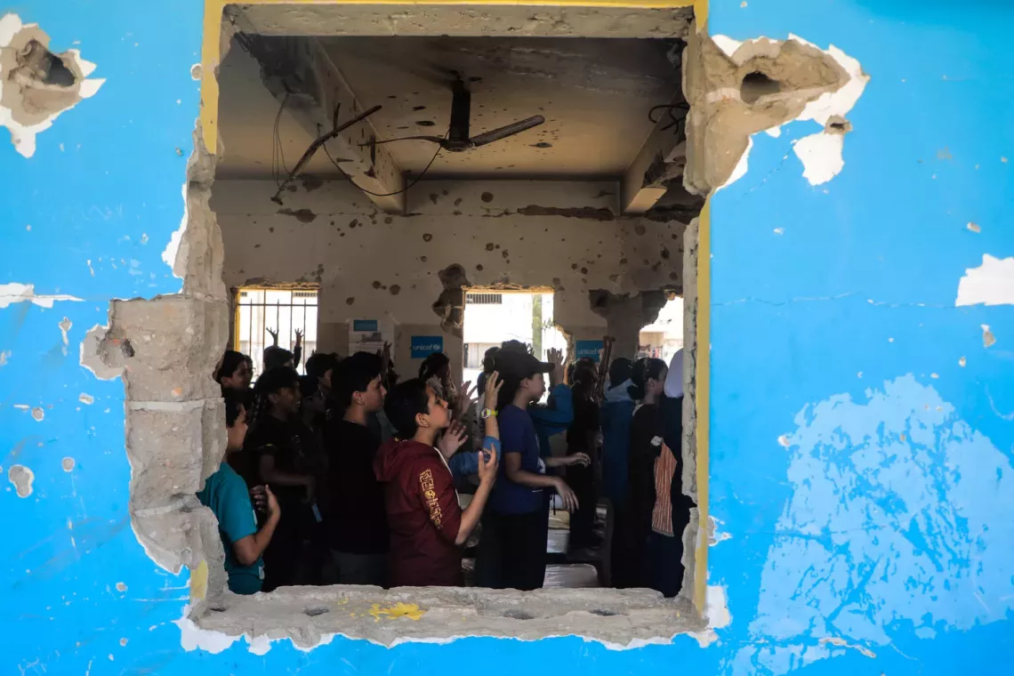 Nateel Children learn how to identify and protect themselves from hidden explosives in a UNICEF-supported class
(UNICEF photo) 