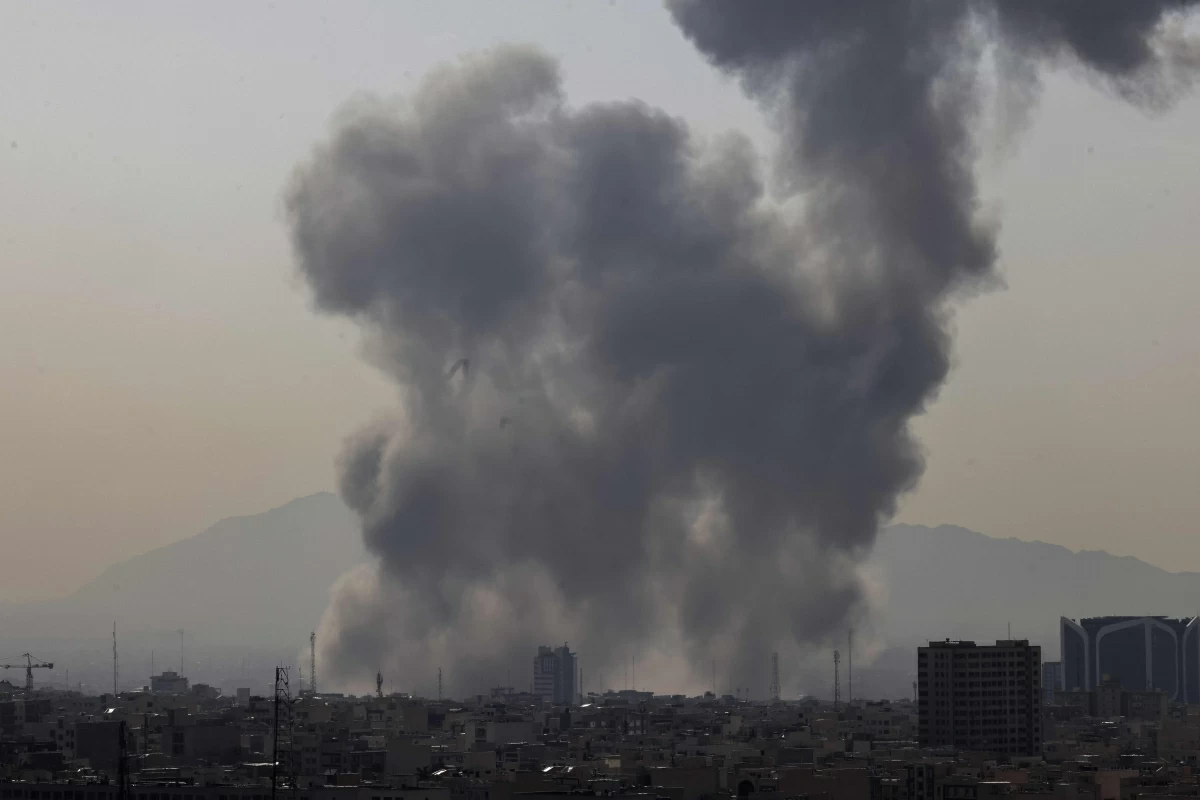 A plume of smoke rises following a reported explosion in Tehran on February 28, 2026 (AFP photo)
