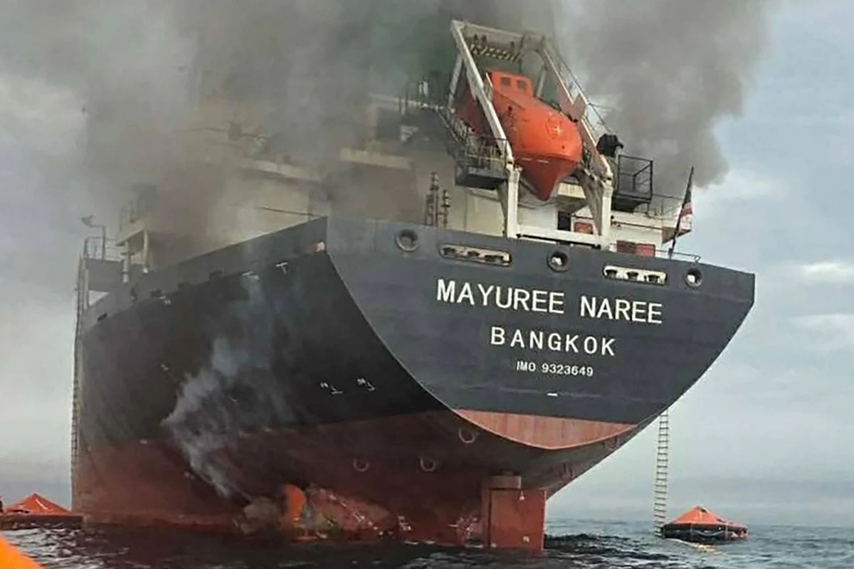 This handout photo taken on March 11, 2026 and released by the Royal Thai Navy shows smoke rising from the Thai bulk carrier 'Mayuree Naree' near the Strait of Hormuz after an attack
(AFP photo)