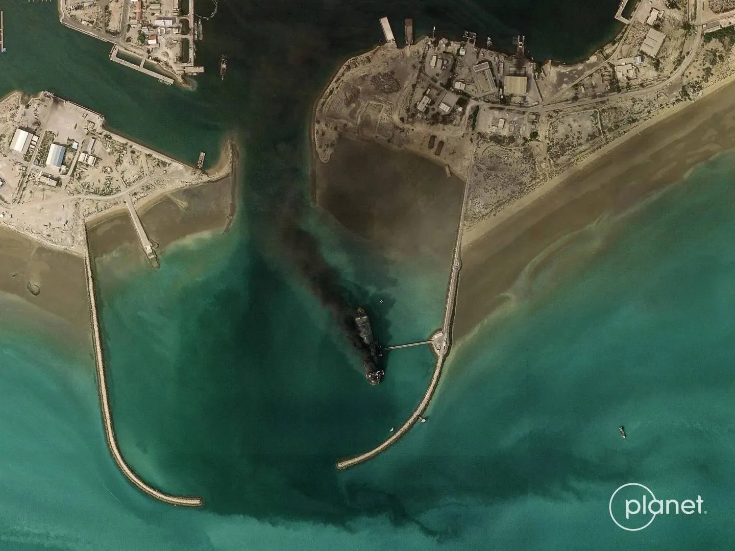 Satellite images show fires burning and vast plumes of black smoke rising from Iran’s main naval headquarters at Bandar Abbas (AFP photo)