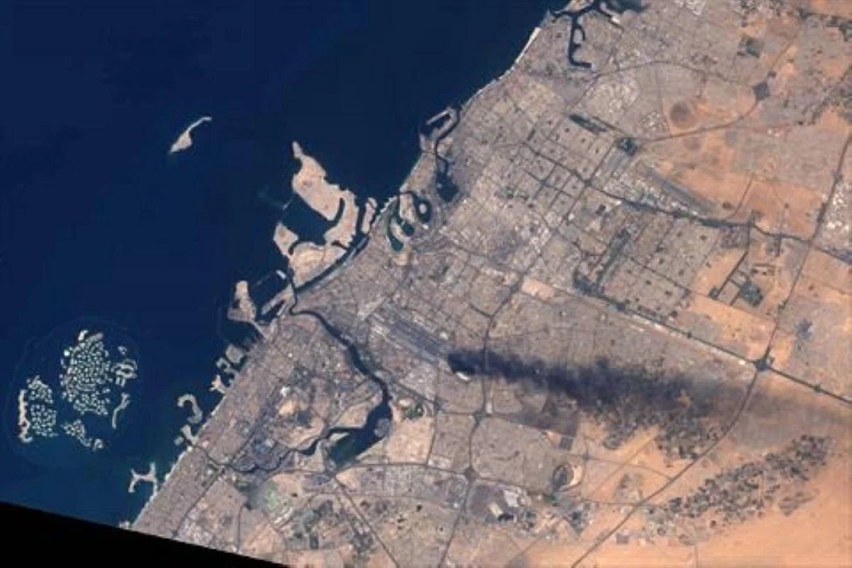 Landsat-8/9 image made available by the US Geological Survey on March 17, 2026, shows a smoke plume rising over Dubai International Airport following an attack on March 16, 2026 (AFP photo)