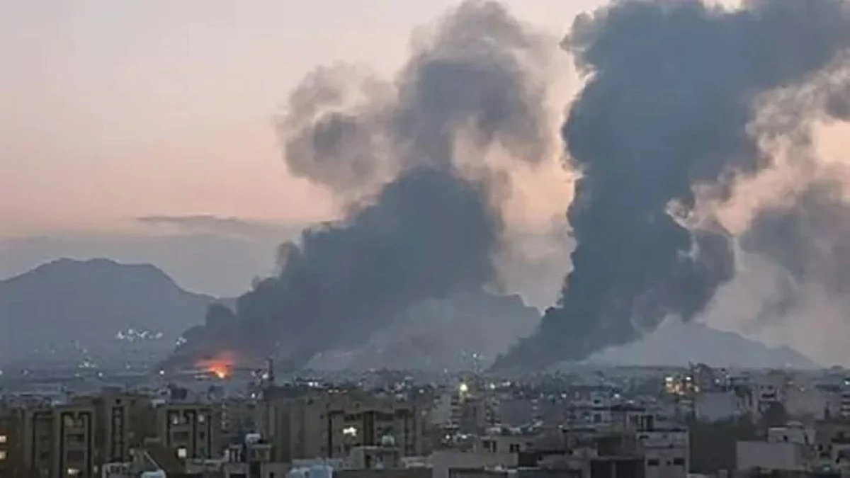 A UGC image posted and shared on social media on March 14, 2026, shows smoke plumes rising over the Iranian city of Isfahan after strikes (AFP photo)