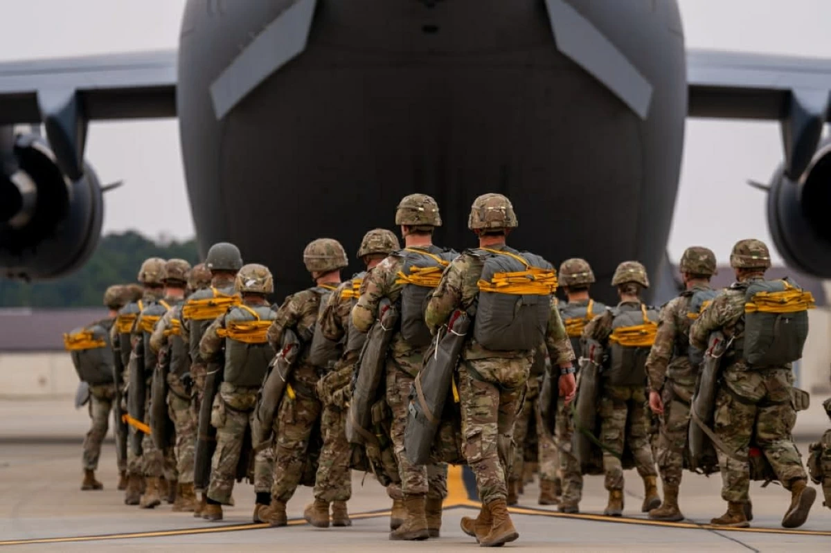 An image shows Paratroopers assigned to the 82nd Airborne Division walk to a C-17 Globemaster III before an airborne operation at Fort Bragg, North Carolina, March 13, 2025 (AFP via Getty Images)
