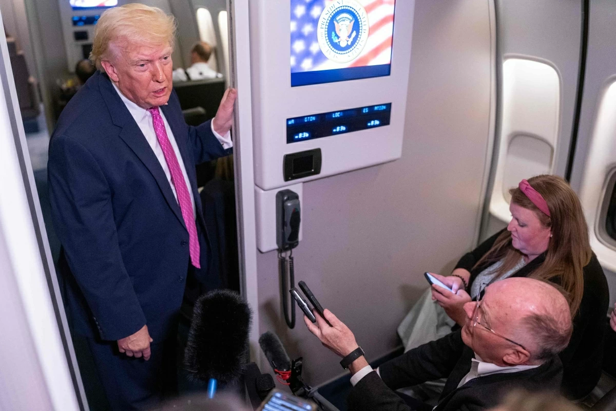 President Donald Trump speaks with members of the media onboard Air Force One on March 29, 2026 while en route to Joint Base Andrews, Maryland from West Palm Beach Florida (AFP photo)