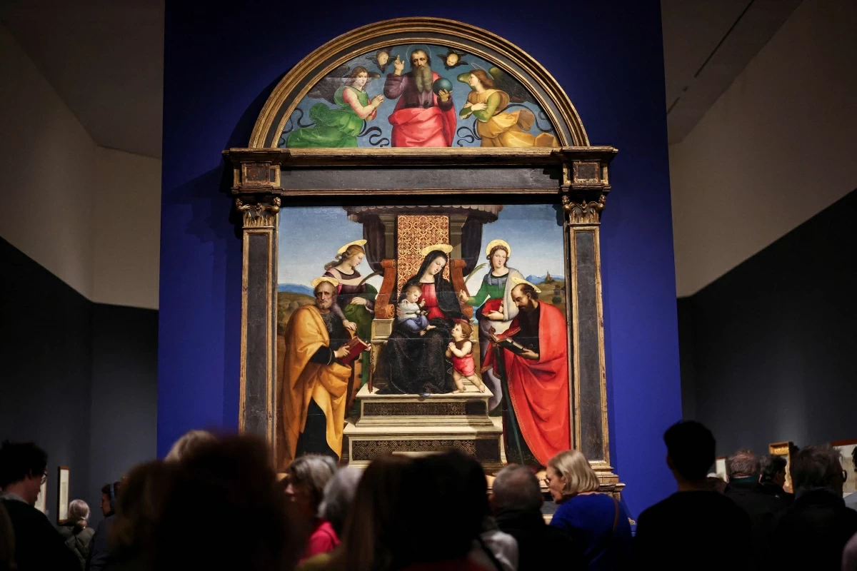 People attend the press preview of the exhibition ‘Raphael: Sublime Poetry’ at the Metropolitan Museum of Art in New York on Friday (AFP photo)
