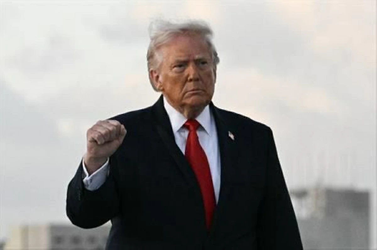 US President Donald Trump makes a fist upon arrival at Miami International Airport in Miami, on April 11, 2026. Trump is traveling to Florida to attend a UFC (AFP photo)