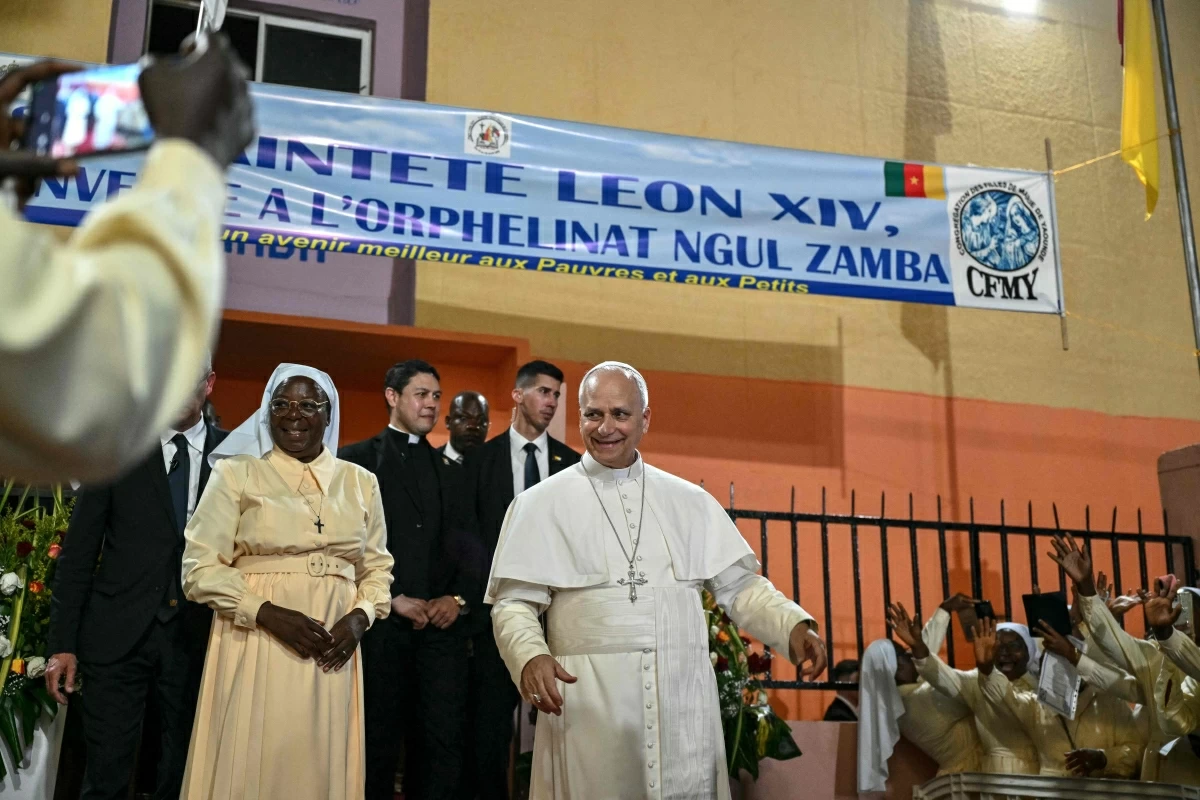 Pope Leo XIV (centre) reacts as he leaves after his visit to the Ngul Zamba (Power of God) orphanage in Yaounde, on the third day of an 11-day apostolic journey to Africa, on Wednesday (AFP photo)