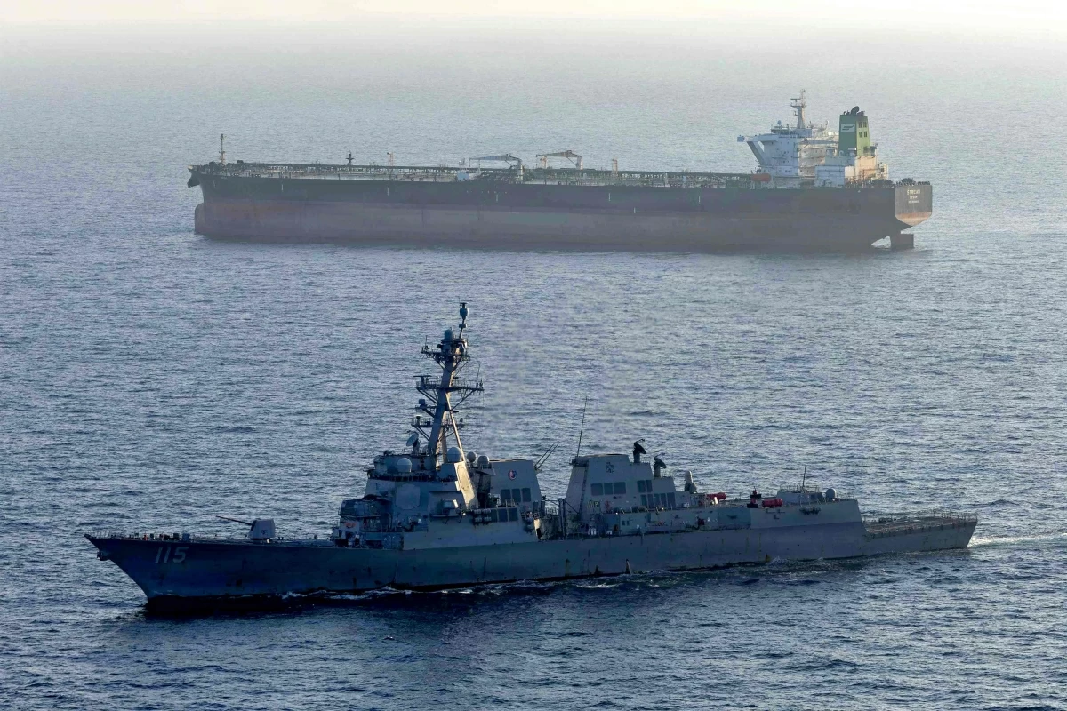 This US Navy handout photo released on May 7, 2026 by US Central Command Public Affairs, shows the Arleigh Burke-class guided-missile destroyer USS Rafael Peralta (DDG 115) implementing a maritime blockade against the Iran-flagged crude oil tanker vessel Stream while the latter was attempting to sail toward an Iranian port, on April 26, 2026 (AFP photo) 