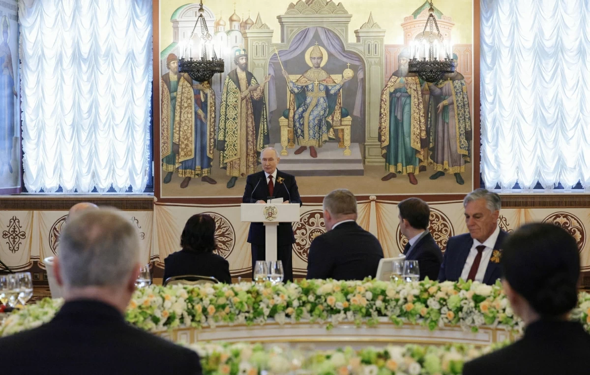 In this pool photograph distributed by the Russian state agency Sputnik, Russia's President Vladimir Putin hosts a reception for foreign leaders attending the Victory Day celebrations, at the Kremlin in Moscow on Saturday (AFP photo)