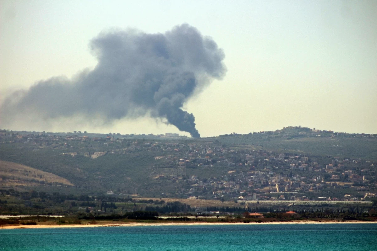 This photograph taken from the southern Lebanese area of Tyre shows smoke rising from the site of Israeli bombardment that targeted the village of Tair Harfa on May 11, 2026 (AFP photo)