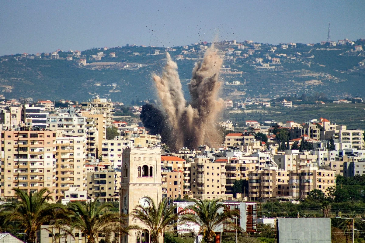 An explosion erupts in the area of al-Housh following Israeli bombardment as seen from Tyre in southern Lebanon on May 12, 2026 (AFP photo)