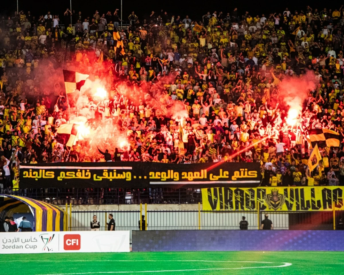 Hussein fans celebrate their victory over Wihdat at Al Hassan Stadium on Tuesday (Photo of Hussein Irbid)