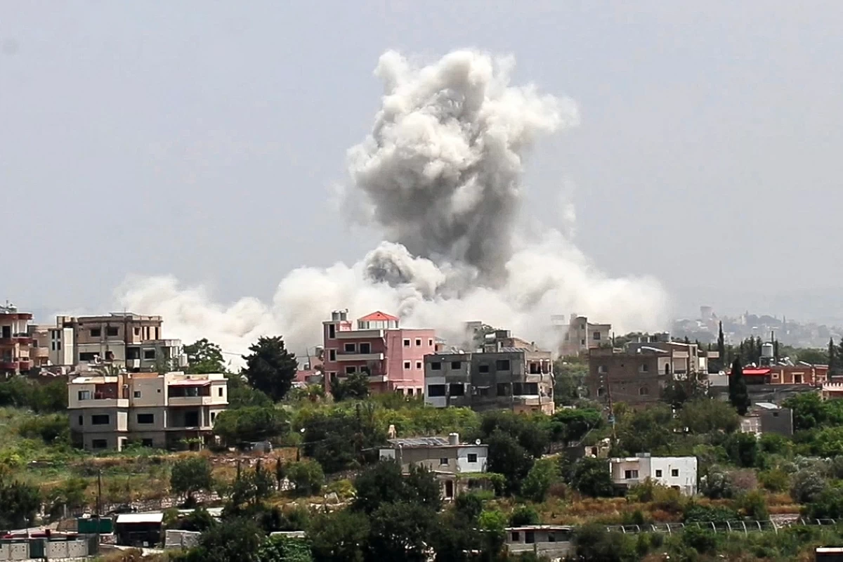 Smoke rises from the site of an Israeli airstrike that targeted the southern village of Al Halloussiyah on May 13, 2026 (AFP photo)
