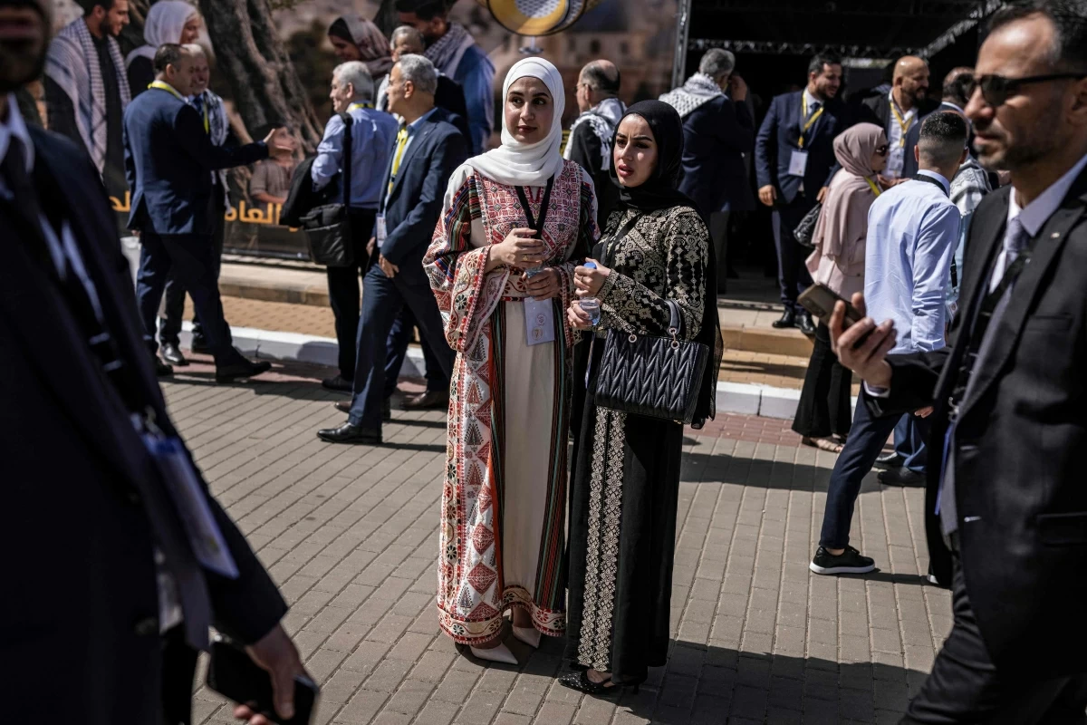 Delegates wearing a traditional dresses look on ahead of Palestinian president Mahmud Abbas' speech during the eighth Fatah Conference in the Israeli-occupied West Bank city of Ramallah on May 14, 2026 (AFP photo)
