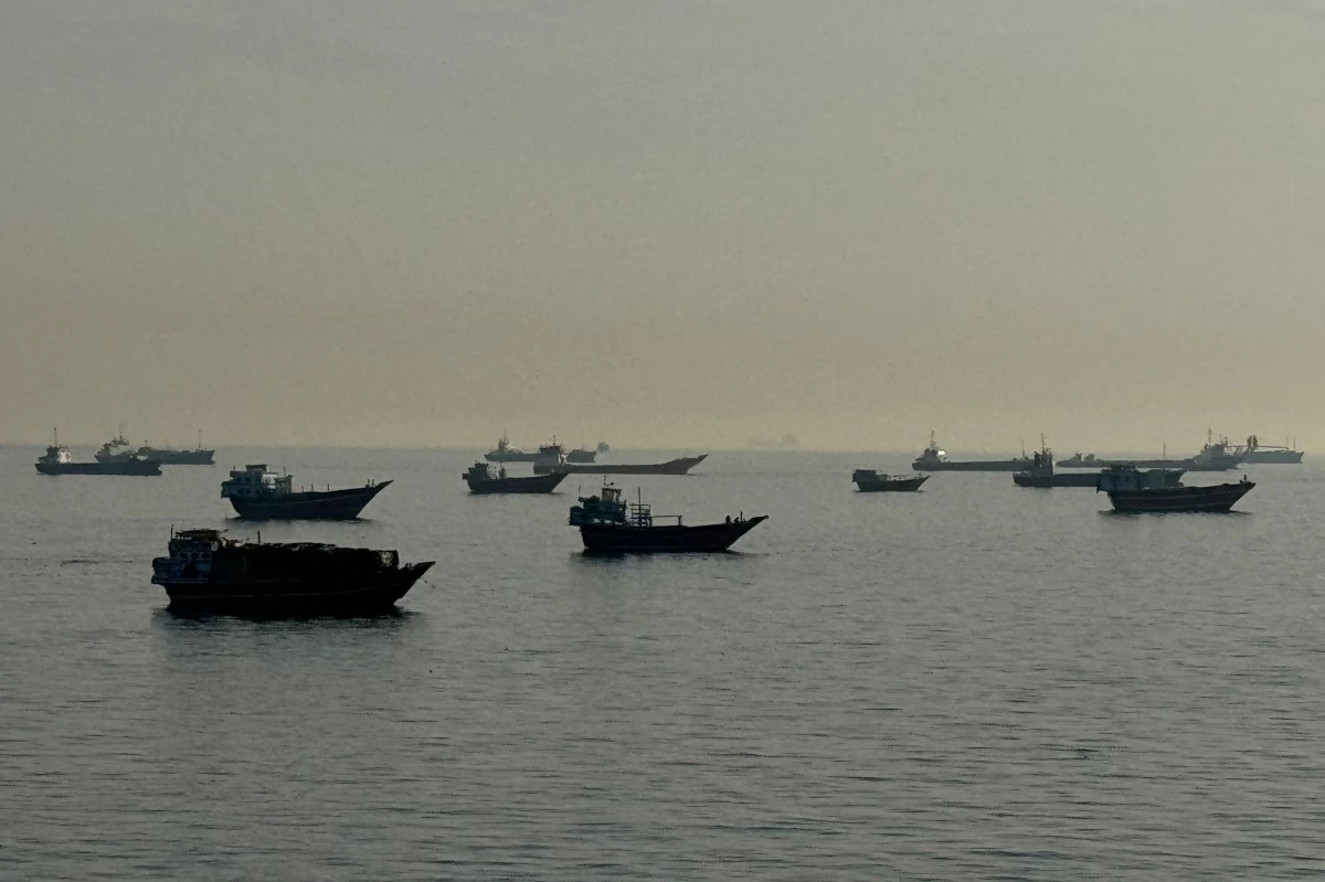 Vessels are seen anchored in the Strait of Hormuz, off the port city of Khasab on Oman’s northern Musandam Peninsula on May 17, 2026 (AFP photo)