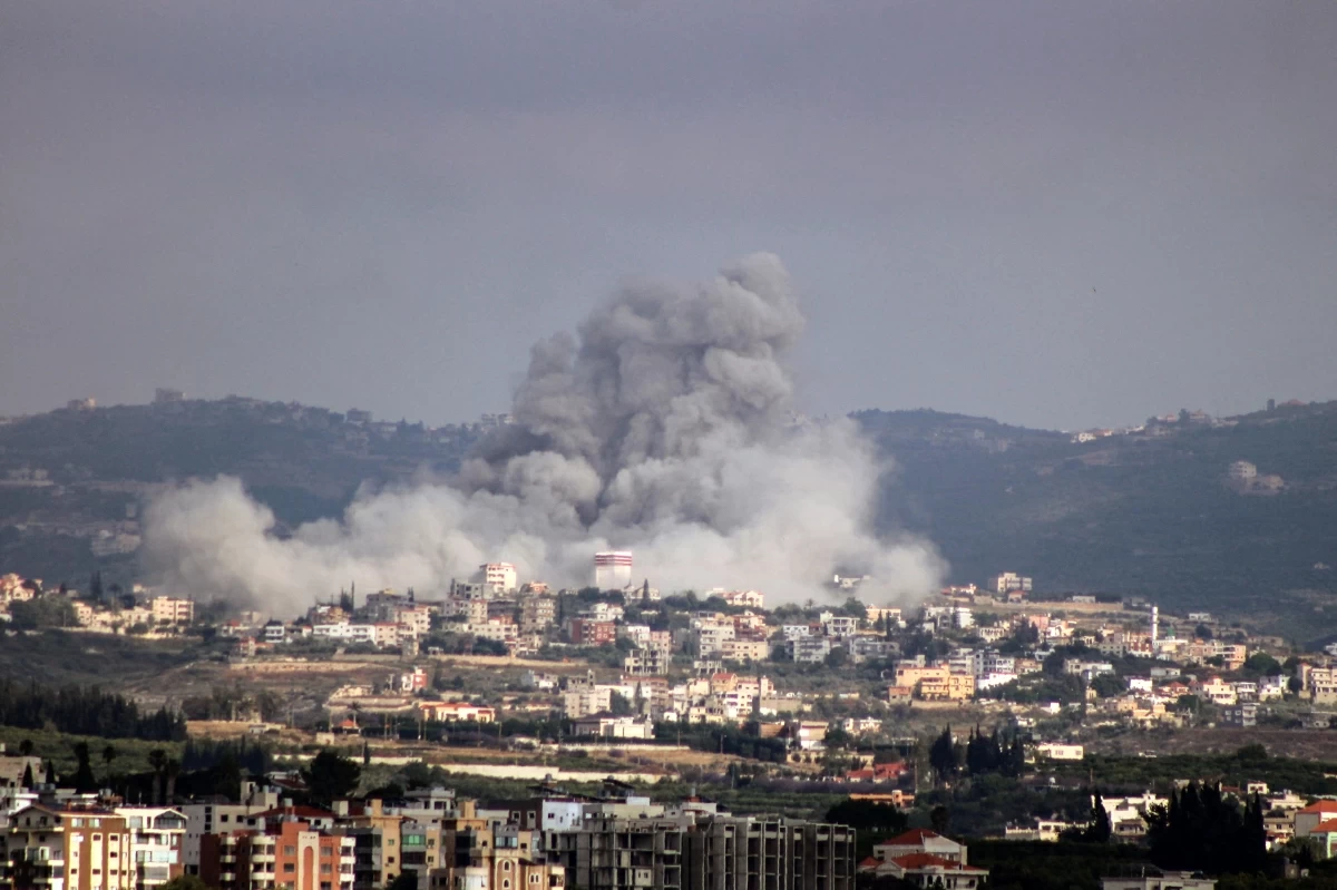 A photograph taken from the Tyre region of southern Lebanon shows smoke rising from the site of Israeli airstrikes that targeted the village of Rmadiyeh in the Tyre district of southern Lebanon on May 26, 2026 (AFP photo)