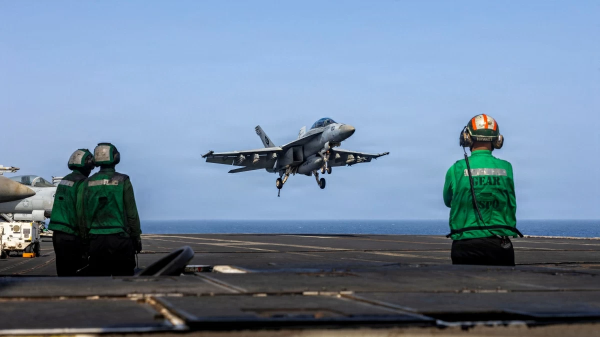 This US Navy handout photo released on May 26, 2026, by US Central Command Public Affairs shows an F/A-18E Super Hornet, attached to Strike Fighter Squadron (VFA) 14, preparing to make an arrested landing on the flight deck of Nimitz-class aircraft carrier USS Abraham Lincoln on May 25, 2026
(AFP photo)