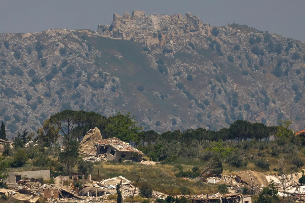 This picture taken from a position in the Upper Galilee region in northern Israel shows destroyed buildings in the southern Lebanon against the backdrop of the medieval Beaufort Castle on June 1 (AFP photo)