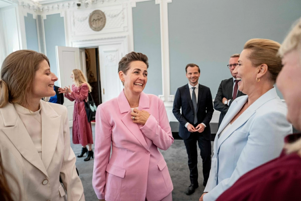 Denmark’s acting Prime Minister Mette Frederiksen (R) shares a smile with designated Minister of Employment and Minister for Gender Equality Ane Halsboe-Joergensen (L), and designated Minister of Economy and Interior Pia Olsen Dyhr (C) as designated members of the Frederiksen III Cabinet meet at the Prime Minister's Office before they go to Amalienborg Castle in Copenhagen, Denmark, on June 3, 2026 (AFP photo)
