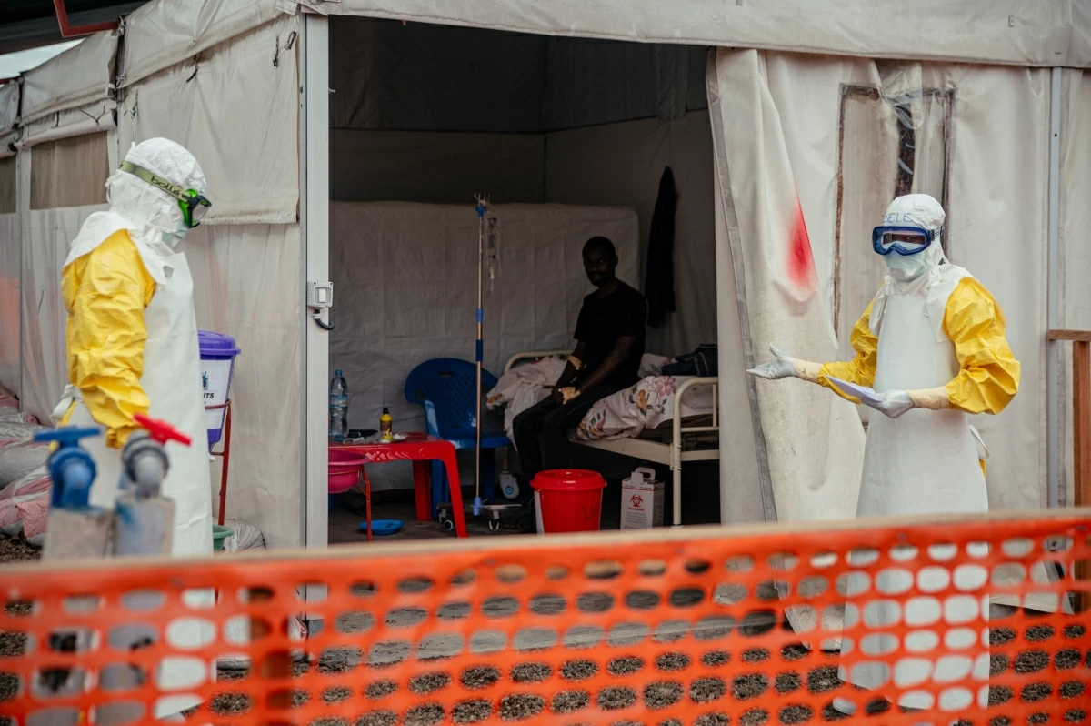 Doctors Without Borders (MSF) doctors wearing personal protective equipment move through the isolated red zone to monitor patients, provide medical care, and ensure sanitation of the facility at the Ebola Treatment Center (ETC) in Munigi on June 2, 2026 (AFP photo)
