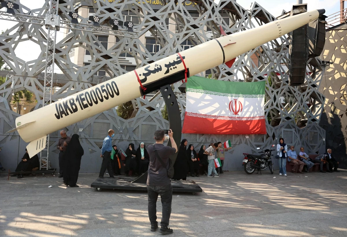 Iranians stand next to a symbol of a Kheibar missile as they take part during a rally in support of the country's supreme leader Mojtaba Khamenei and commemorate Eid Al Ghadir in Tehran on June 4, 2026
(AFP photo)