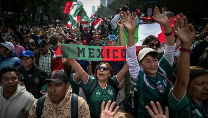 Thousands of Mexicans packed the capital city's streets in an effort to set a new Guinness record for the world's largest human wave (AFP photo)