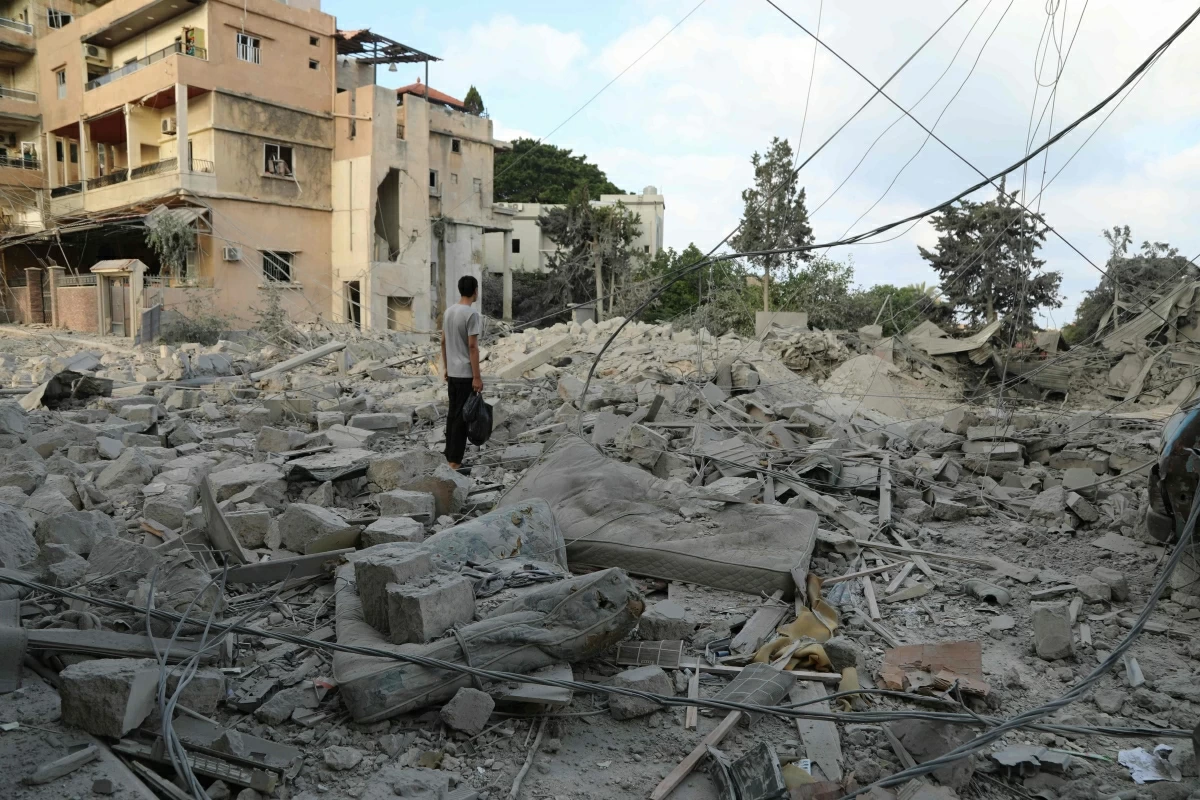 A man stands amid debris following Israeli airstrikes that hit the previous day, near the archaeological site of the Roman hippodrome in the southern Lebanese city of Tyre on Monday
(AFP photo)