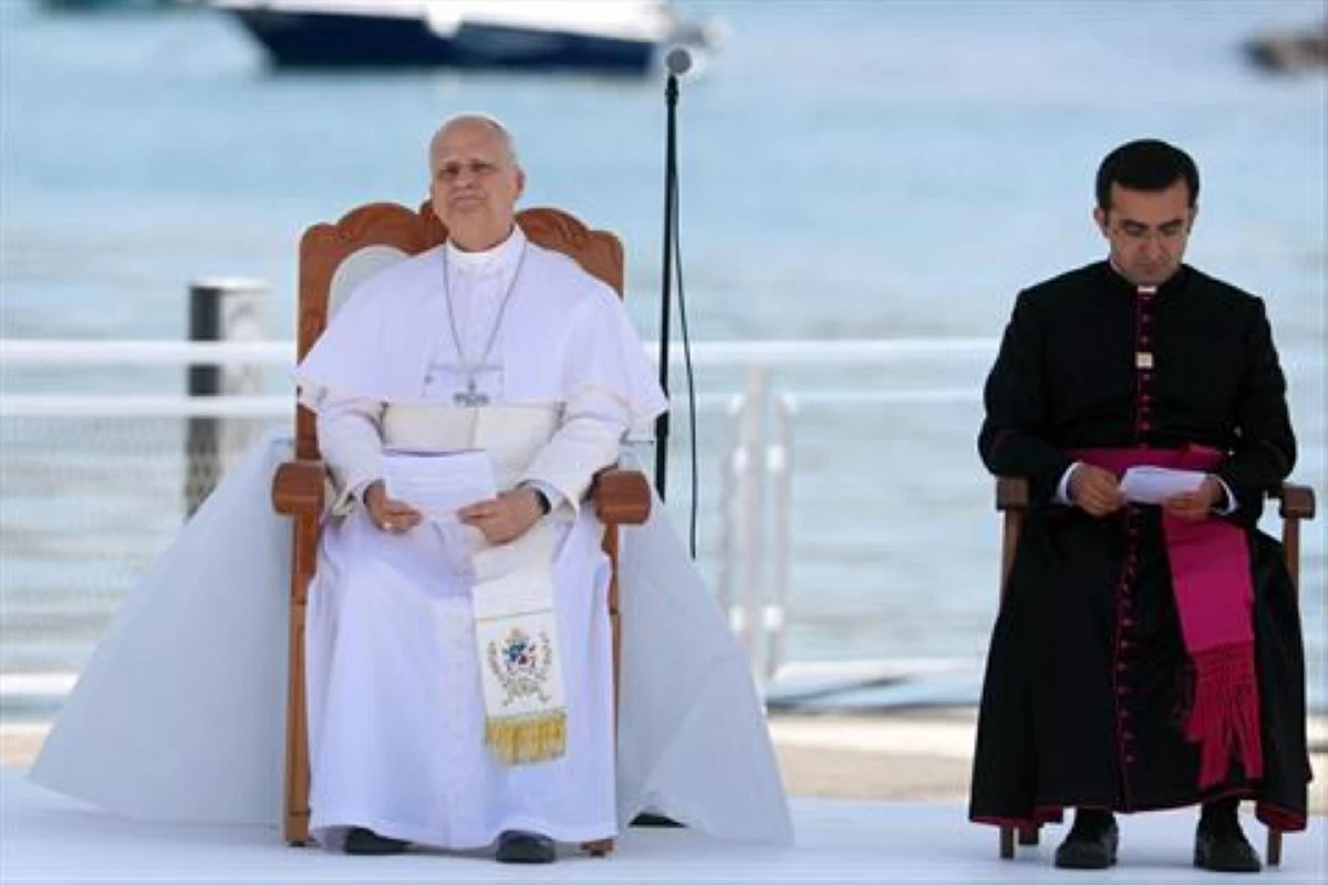 Pope Leo XIV (L) attends a meeting with organizations working with migrants in the port of Arguineguin on the Canary Island of Gran Canaria, a place accustomed to the arrival of migrants, on June 11, 2026 (AFP photo)