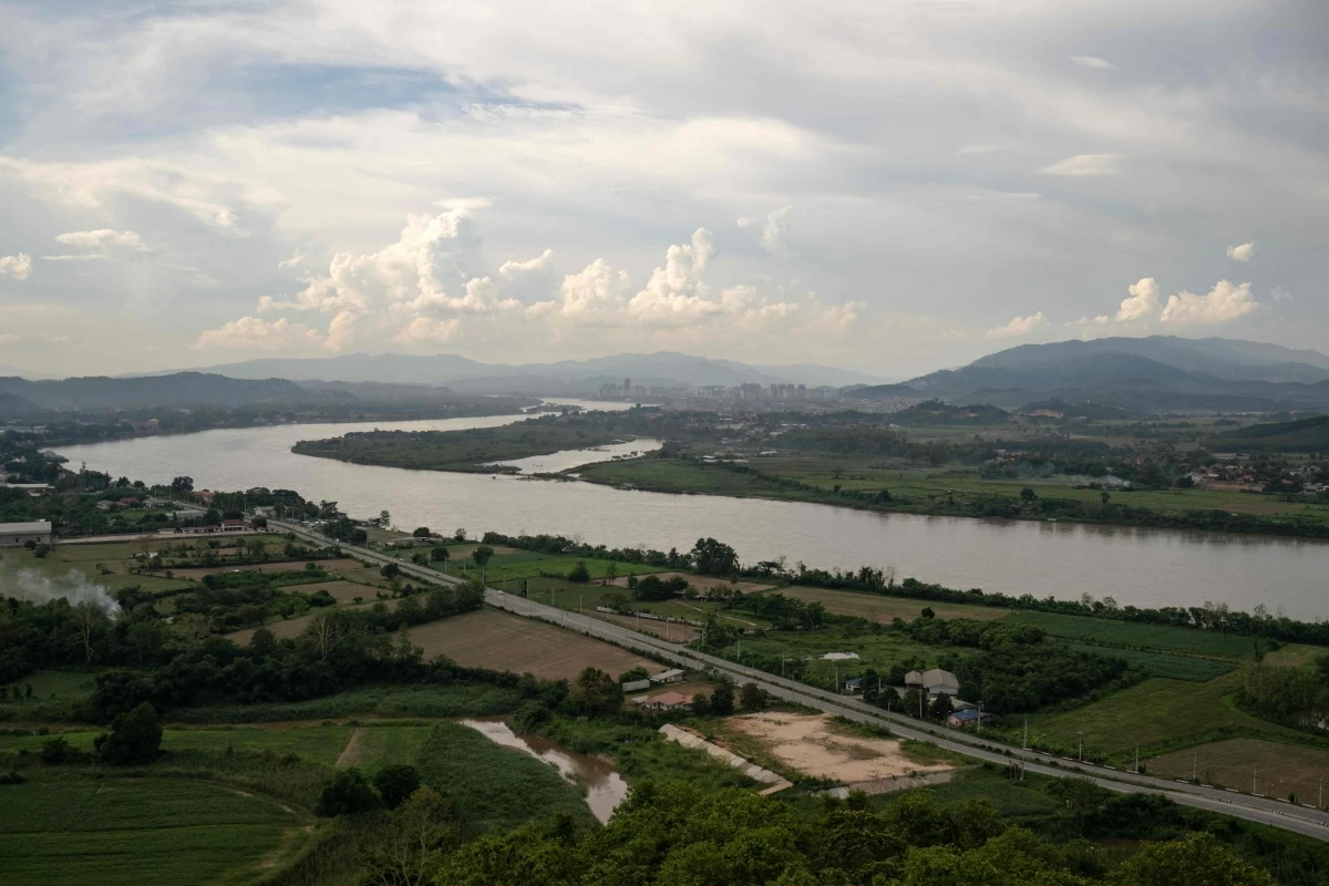 This photo taken on June 4shows a view of the Mekong River and the Golden Triangle Special Economic Zone within Laos' Bokeo province (right), from Chiang Saen, northern Thailand's Chiang Rai province
(AFP photo)