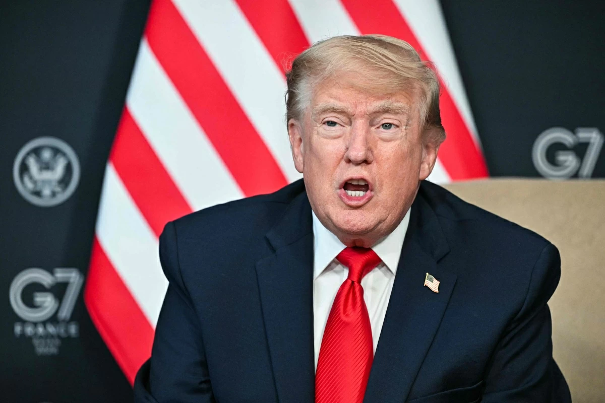 US President Donald Trump attends a bilateral meeting with Qatar's Emir on the sidelines of the G7 summit, in Evian, eastern France, on June 16, 2026 (AFP photo)