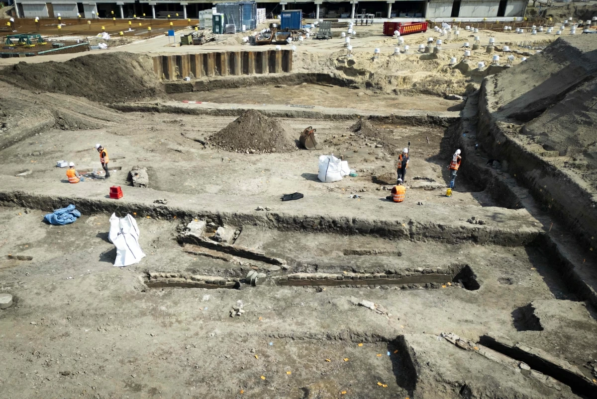 This aerial view shows researchers working at the site where a large section of a Roman bathhouse has been uncovered in Nijmegen on Tuesday (AFP photo)