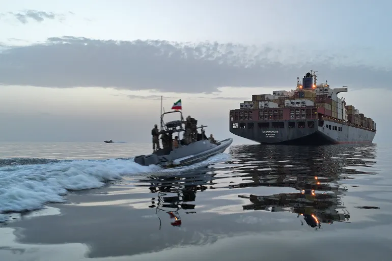 This photo obtained from the Iranian news agency Tasnim shows an IRGC boat allegedly taking part in an operation to seize ships attempting to cross the Strait of Hormuz, on April 21, 2026 (AFP photo)