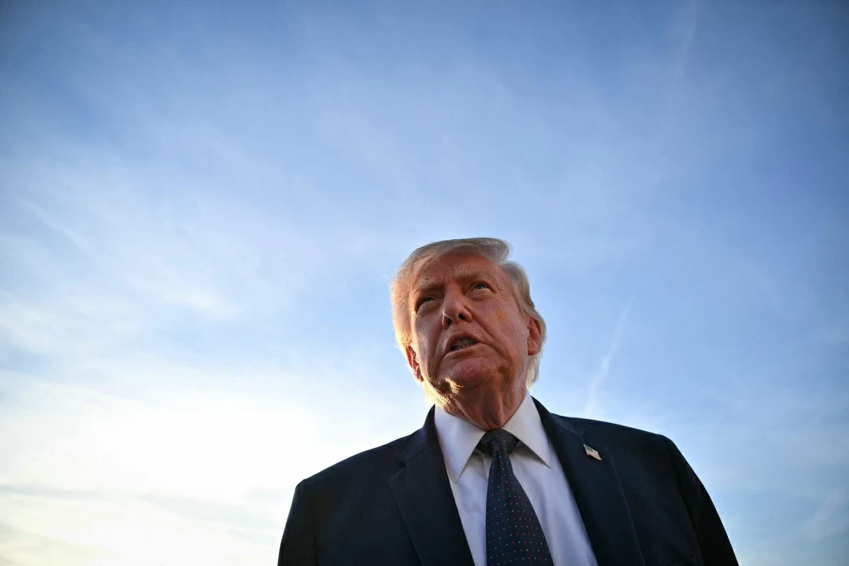 US President Donald Trump addresses the media on the tarmac after arriving at Paris Orly Airport enroute to a dinner to celebrate the 250th anniversary of the independence of the United States, at Orly Airport, south of Paris, on June 17, 2026 (AFP photo)