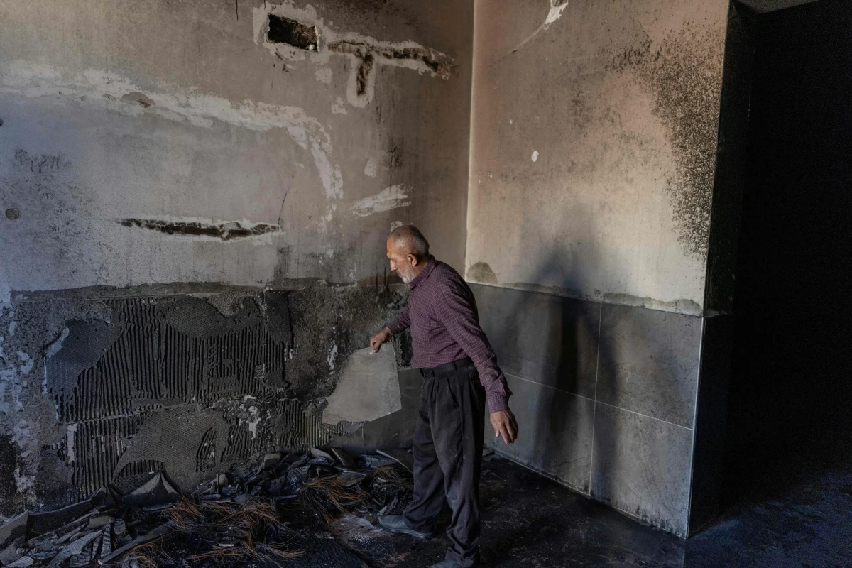 A Palestinian man inspects the damage inside a mosque reportedly burnt by Israeli settlers over night, in the Israeli occupied West Bank village of Jiljlia, just north of the West Bank city of Ramallah on June 17, 2026
(AFP photo)