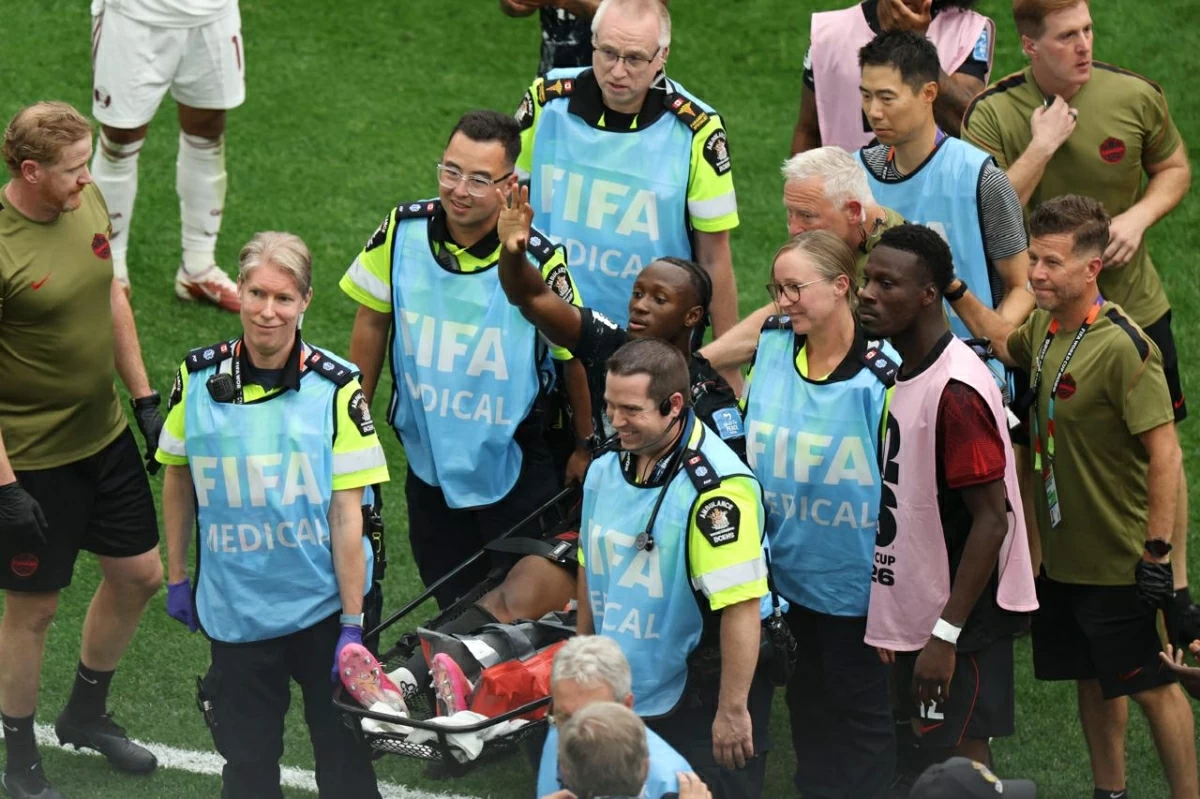 Ismael Kone of Canada waves to crowd as he is stretched off after being fouled by Assim Madibo of Qatar during the FIFA World Cup 2026 Group B match between Canada and Qatar at BC Place Vancouver on June 18, 2026 in Vancouver, British Columbia (AFP photo)